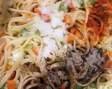 A picture of step 3 of Spaghettis and veg rolls.