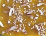 A picture of step 5 of Mango flavoured milk cake in two layers.