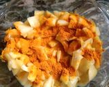 A picture of step 4 of Mango pickle with asafoetida.