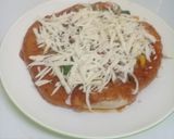 A picture of step 17 of Home made pizza with vegetables n cheese toppings.