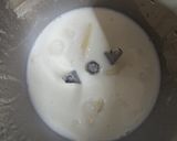 A picture of step 2 of Milkybar milk shake.