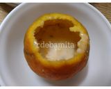 A picture of step 3 of Orange Kulfi in orange shell.