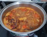 A picture of step 4 of Nam Ngiao (Northern Thai Pork Noodle Soup).