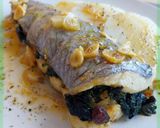 Foto del paso 13 de la receta: Merluza rellena de espinacas con langostinos y pasas