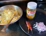 A picture of step 1 of Aloo Bharta- Indian Mashed Potatoes.