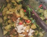 A picture of step 6 of Coconut green peas with potatoes.