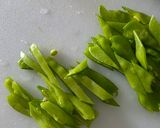 A picture of step 2 of Chinese stir fry - Snow Peas with dried shrimps and garlic.