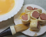 Foto del paso 8 de la receta: Bollo de hojaldre con frankfurt y queso