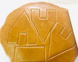 A picture of step 3 of “Eggless Gingerbread House” with icing.