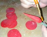 A picture of step 8 of Valentines day special fondant red rose cake topper.
