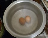 A picture of step 4 of #theme challengeRice and split green grams with egg.