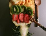 A picture of step 5 of Fruit salad in a pineapple boat.