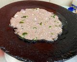 A picture of step 5 of Ragi rotti with drumstick leaves.