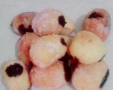 A picture of step 11 of The Happiness with Chocolate filled mini donuts.