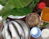 A picture of step 1 of Pabda Paturi (with Taro/ kochu/Alvi leaves) and Pabda Bhappa.