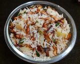 A picture of step 7 of Potato Pulao.