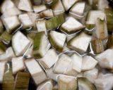 A picture of step 1 of Raw banana masala.