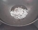 A picture of step 1 of Rava kesari with dessicated coconut and toasted sesame.
