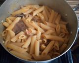A picture of step 4 of Penne Jollof.