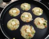 A picture of step 3 of Cheese rawa appe omelette.