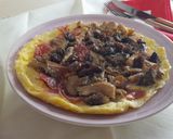Foto del paso 4 de la receta Tortilla abierta con setas y pasas