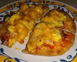 A picture of step 6 of Pita Breakfast Pizza.