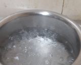 A picture of step 2 of Bengali Lebu Cha or Lemon Tea.