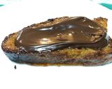 Foto del paso 10 de la receta: Torrijas al horno de miel, naranja y chocolate