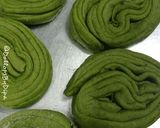 A picture of step 2 of Hariyala laccha paratha (layered green flat bread).