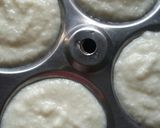 A picture of step 5 of Ice-Cream pomegranate sweet Idli Sandwich.