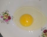 A picture of step 1 of Egg cheese roll.