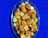 A picture of step 6 of Papaya and Fritters Curry.