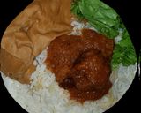 A picture of step 1 of While rice and leafy moimoi.