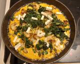 A picture of step 4 of Spinach, potato and feta "tortilla" with a fried egg.