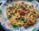 A picture of step 8 of Besan onion tomato chilla.