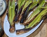 A picture of step 2 of Char-grilled leeks.