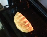 A picture of step 7 of Domino's style stuffed cheese garlic bread.