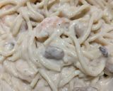 A picture of step 11 of Creamy alfredo chicken and shrimp pasta.