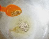 A picture of step 1 of Garlic coriander rice.