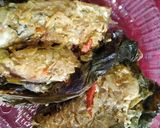 A picture of step 5 of Katla fish in gourd leaves.