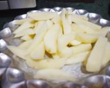 A picture of step 1 of Potato brinjal and onion stuff.