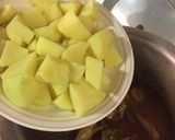 A picture of step 7 of Aloo chicken.