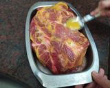 A picture of step 3 of Pork Shoulder with Mustard, Spiced Plums, and Orange Sweet Potato Mash.
