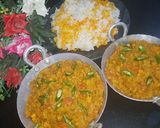 A picture of step 7 of Dam allu with colourful zeera rice.