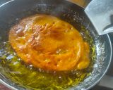 A picture of step 4 of Mango malpua with fresh cream.