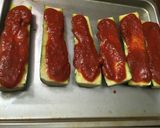A picture of step 5 of Zucchini Pizza Boats.