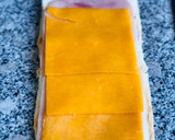 Foto del paso 2 de la receta: Rollitos de pan de molde con jamón y queso