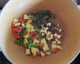 A picture of step 1 of Achari Mango Rice.