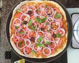 A picture of step 4 of Italian thin crust pizza.