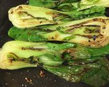 A picture of step 4 of Inside out gyosa with baby bok choy.